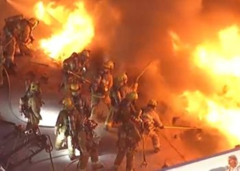 Watch: LA Firefighters Battle Massive Blaze From Roof